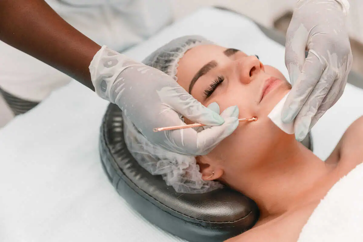 esthetician performing acne bootcamp facial extraction treatment in Murrells Inlet SC